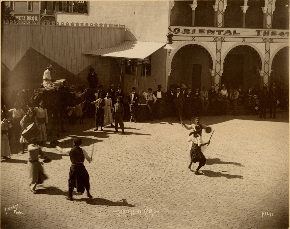 Performers sword fight on Streets of Cairo.