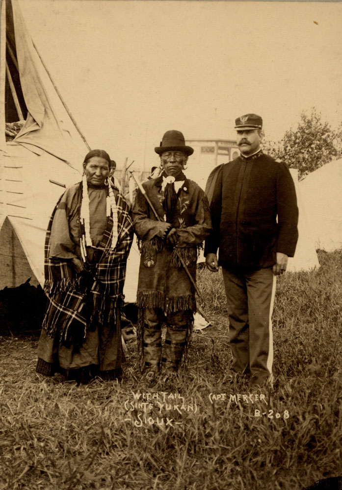 Group Portrait of Indian Congress Participants. Sioux Delegates. Unidentified Woman, With Tail (Sinte Yukan), and Captain W.A. Mercer