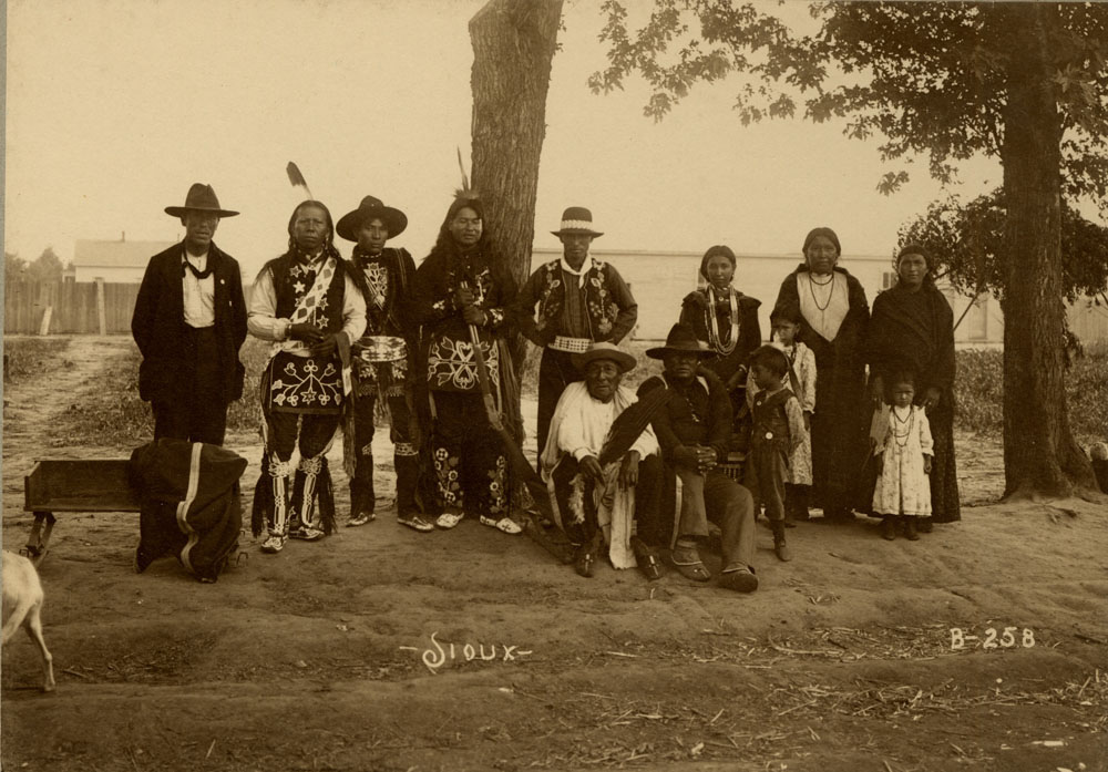 Group Portrait of Indian Congress Participants. Sioux Delegates. Thirteen Unidentified Men, Women, and Children.