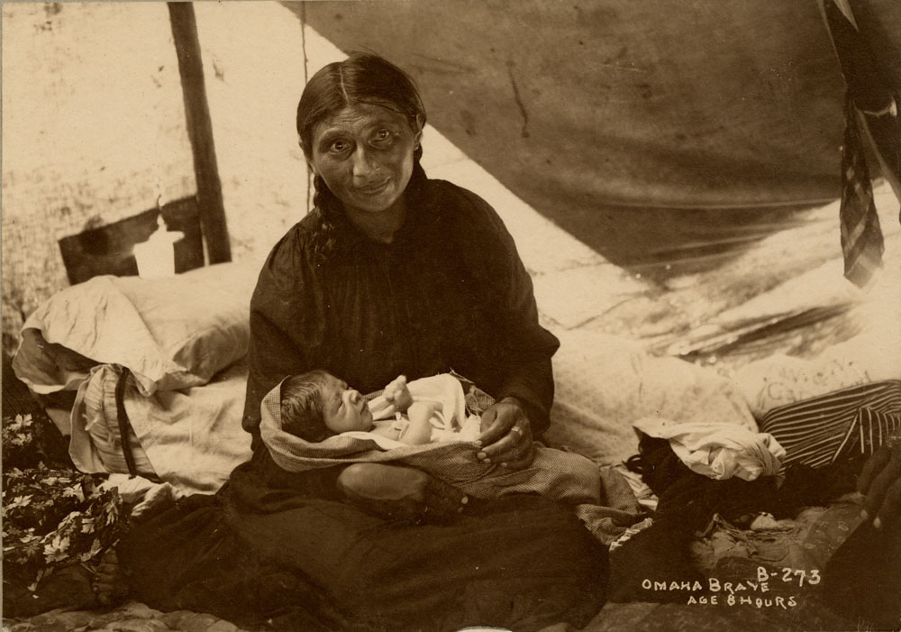 Mother holding newborn son, born at the Indian Congress eight hours prior. Mother is an Omaha delegate--possibly Mrs. Spotted Back.