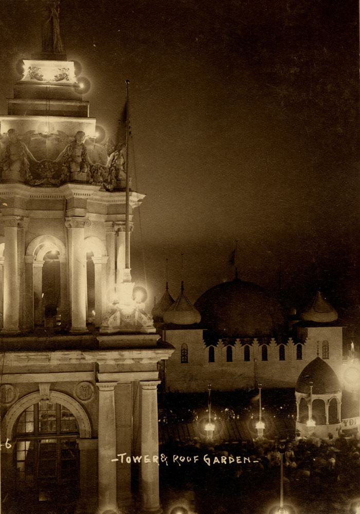 Twin Tower Restaurant at night, looking north, with view of crowded roof garden and Moorish Palace.