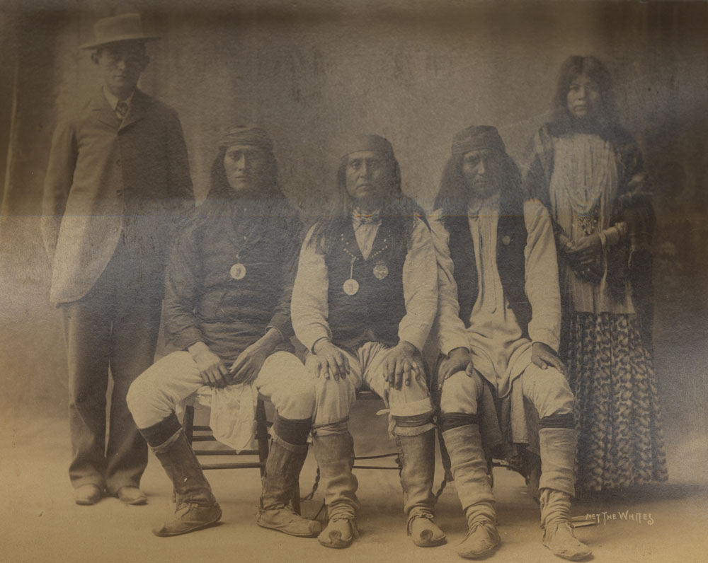 Group Portrait of Indian Congress Participants. White Mountain Apache Delegates: James Stevens, Interpreter; Bailda (Forgetfulness); Chief Josh; Deze; Unidentified Woman