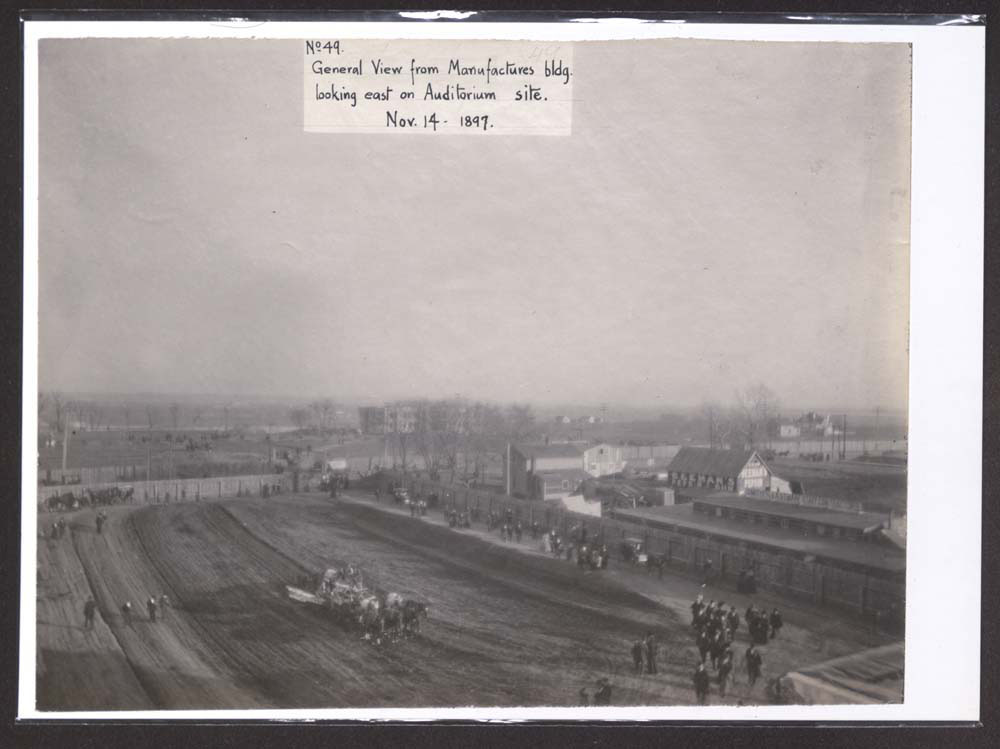 Grand Court Construction. Mines and Mining Building and Auditorium sites. Crowd walking. And in horse drawn carriages.