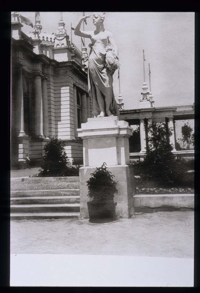 Detail of Manufactures Building and Colonnade with Statue of Ceres in foreground. Potted plant at base of statue.